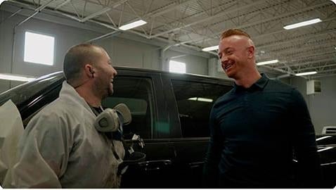 image of 2 men speaking